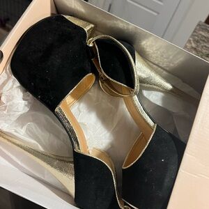 Black and gold heel
